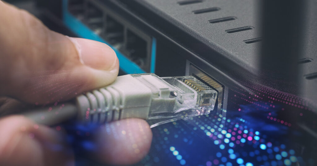 Image of an ethernet cable being plugged into a computer.