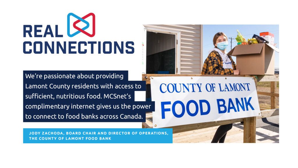 young woman with plaid shirt and mask stands in front of lamont food bank building with a food hamper