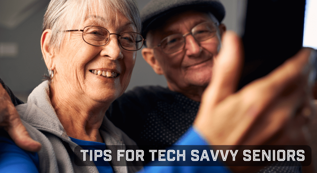 An elderly couple smiling using their mobile phone for a video call.