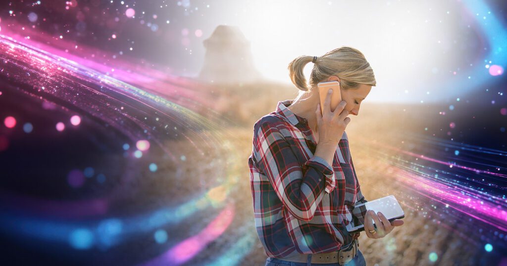 Lady on the phone and using the internet to connect a tablet, surrounded by MCSnet internet connection waves.
