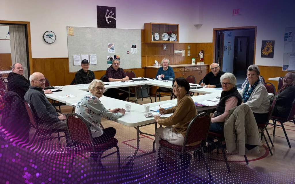 The dedicated board members at the Pioneer Circle Seniors Centre sitting around a table,
