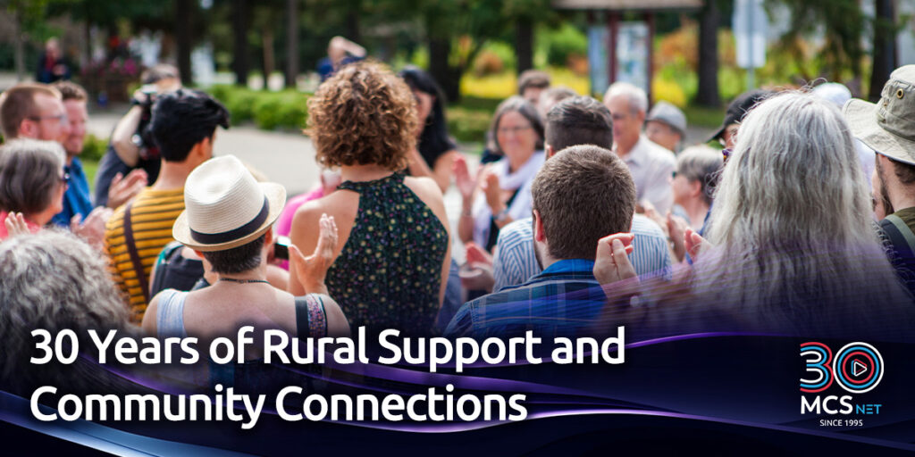 Image of a community gathering on a street outside withe the title: 30 Years of Rural Support and Community Connections.