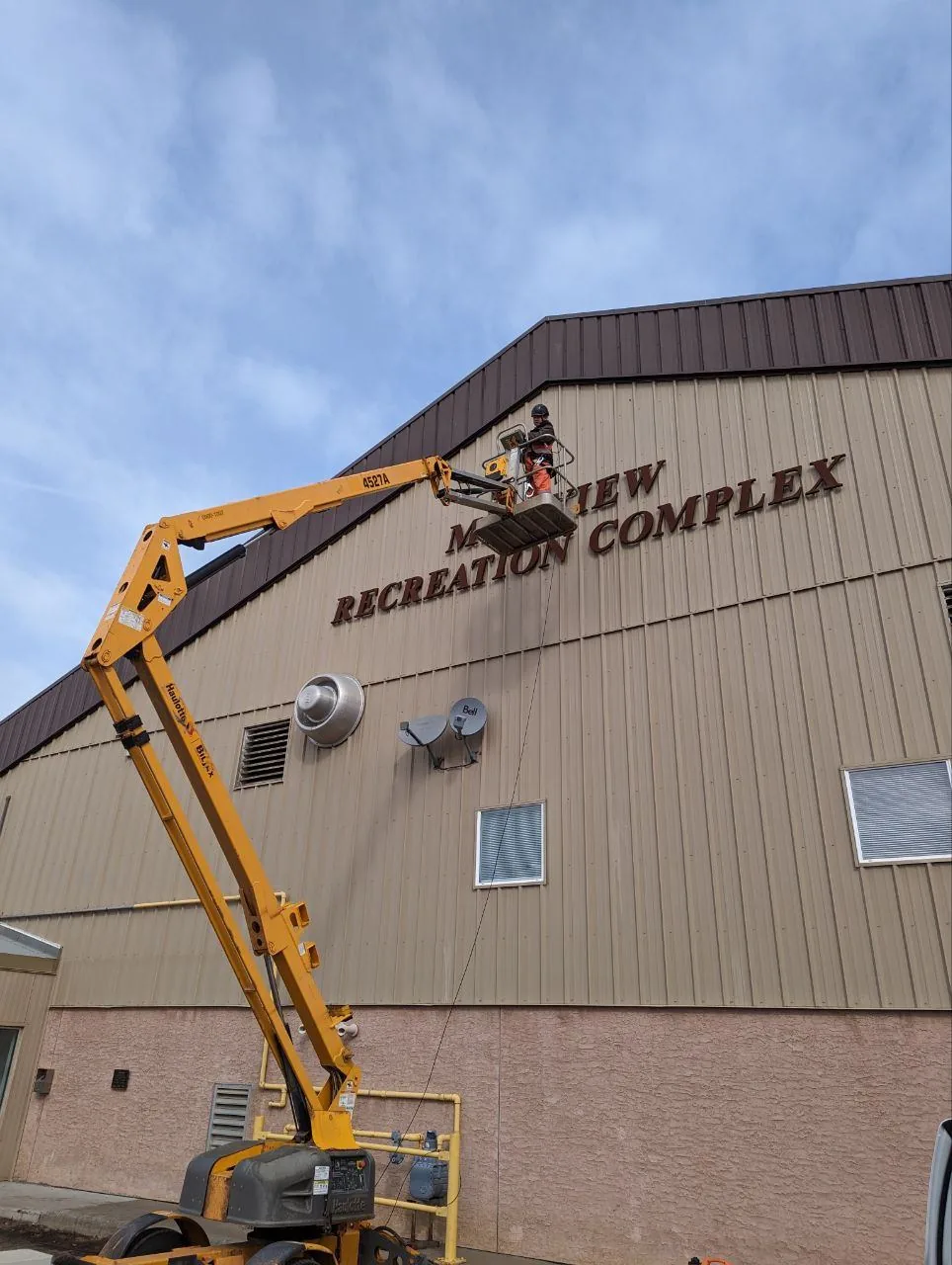 Crew installing internet equipment at the Millview Recreation Complex, home of Boyle's free MCSnet GigAir Wi-Fi hotspot