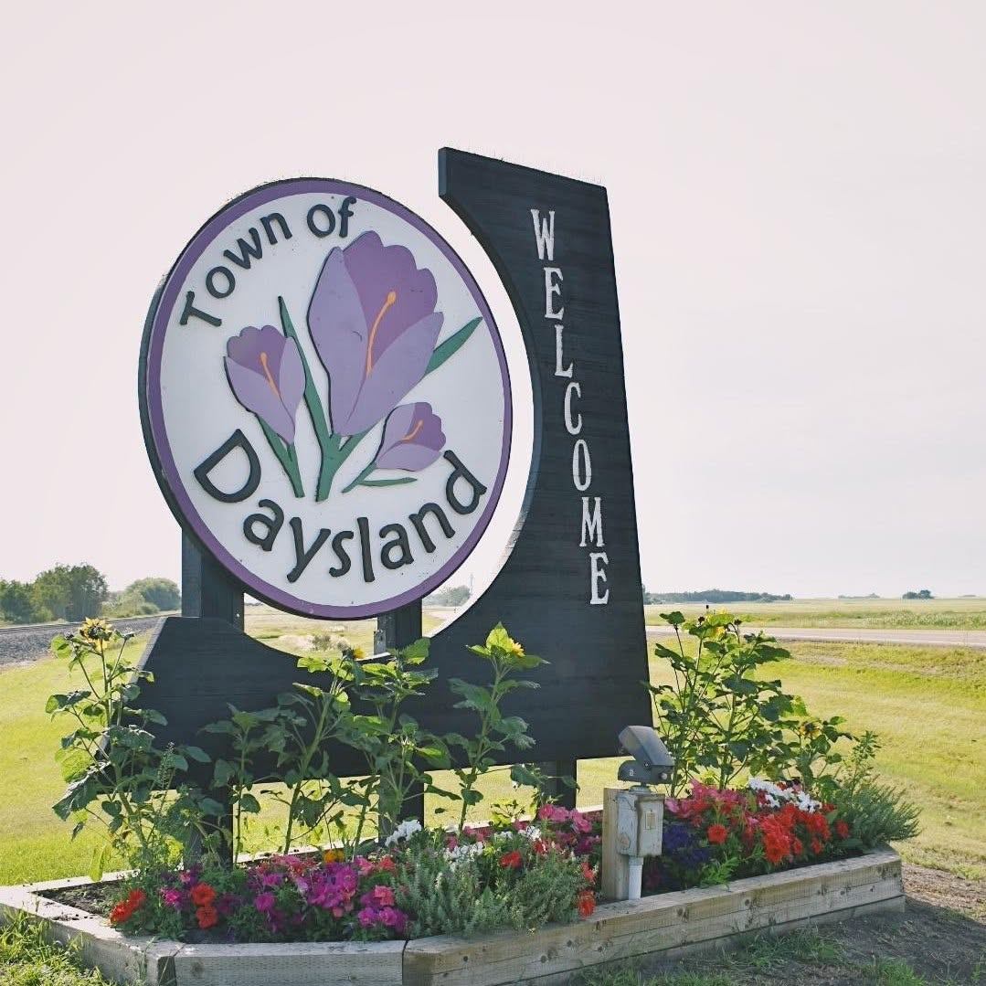 Town of Daysland, Alberta welcome sign with crocus flower emblem
