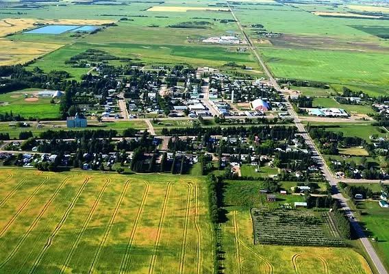Aerial view of farmland and a hamlet in Lamont County, Alberta