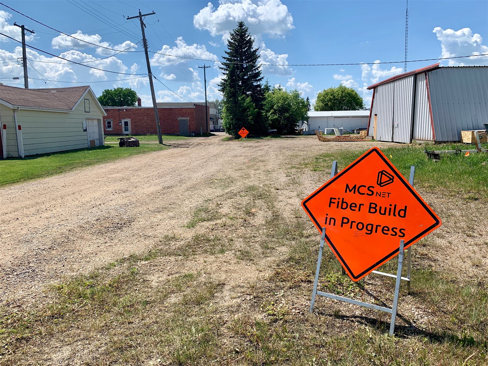 MCSnet fiber build in progress sign on a street in Mallaig, Alberta