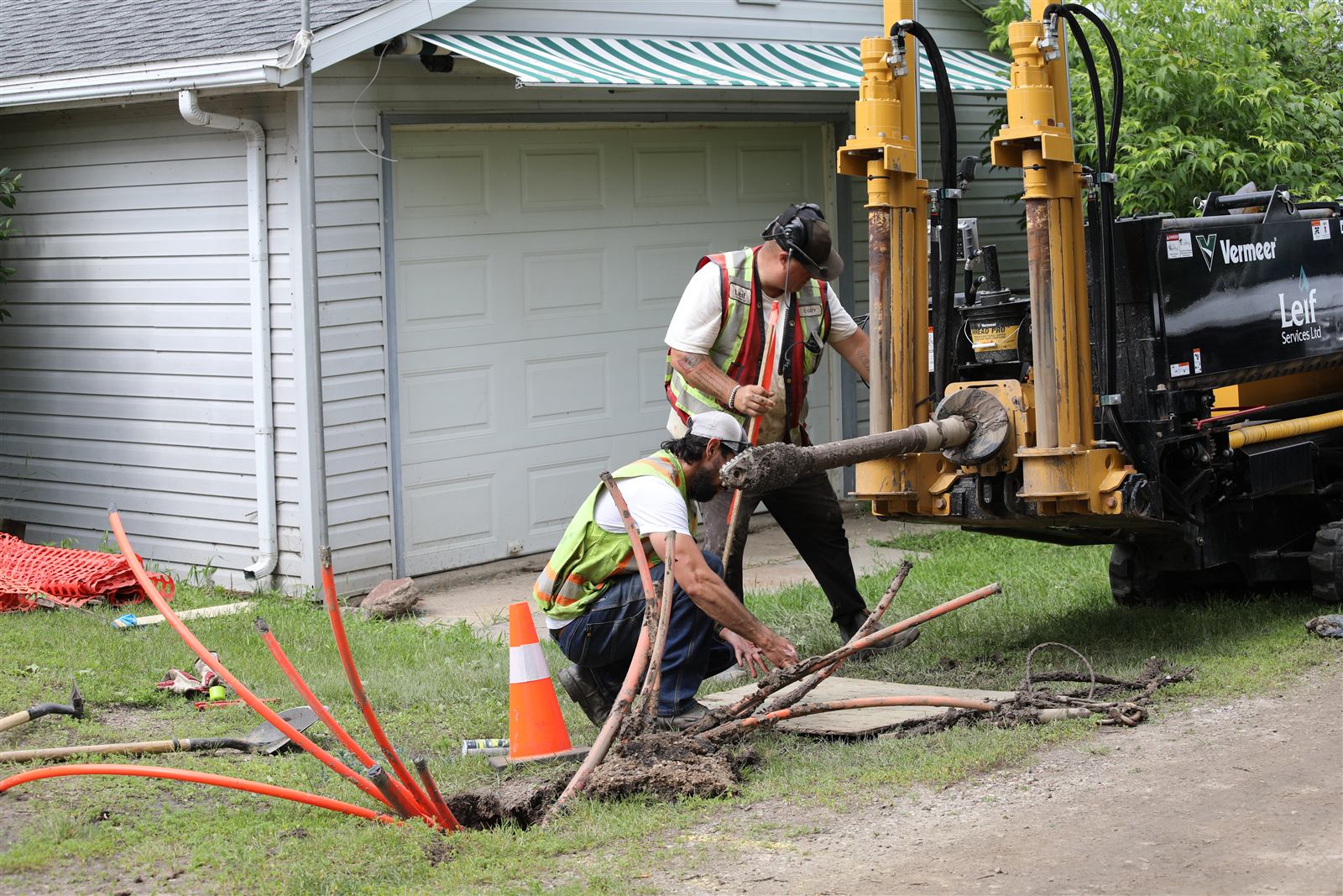 Crew directional boring fiber optic conduit for MCSnet near Moose Lake, Alberta