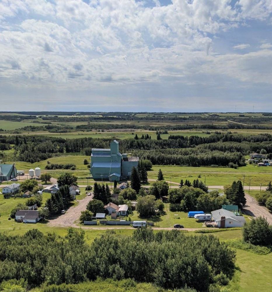 Aerial view of Myrnam, Alberta, showing the grain elevator and village streets