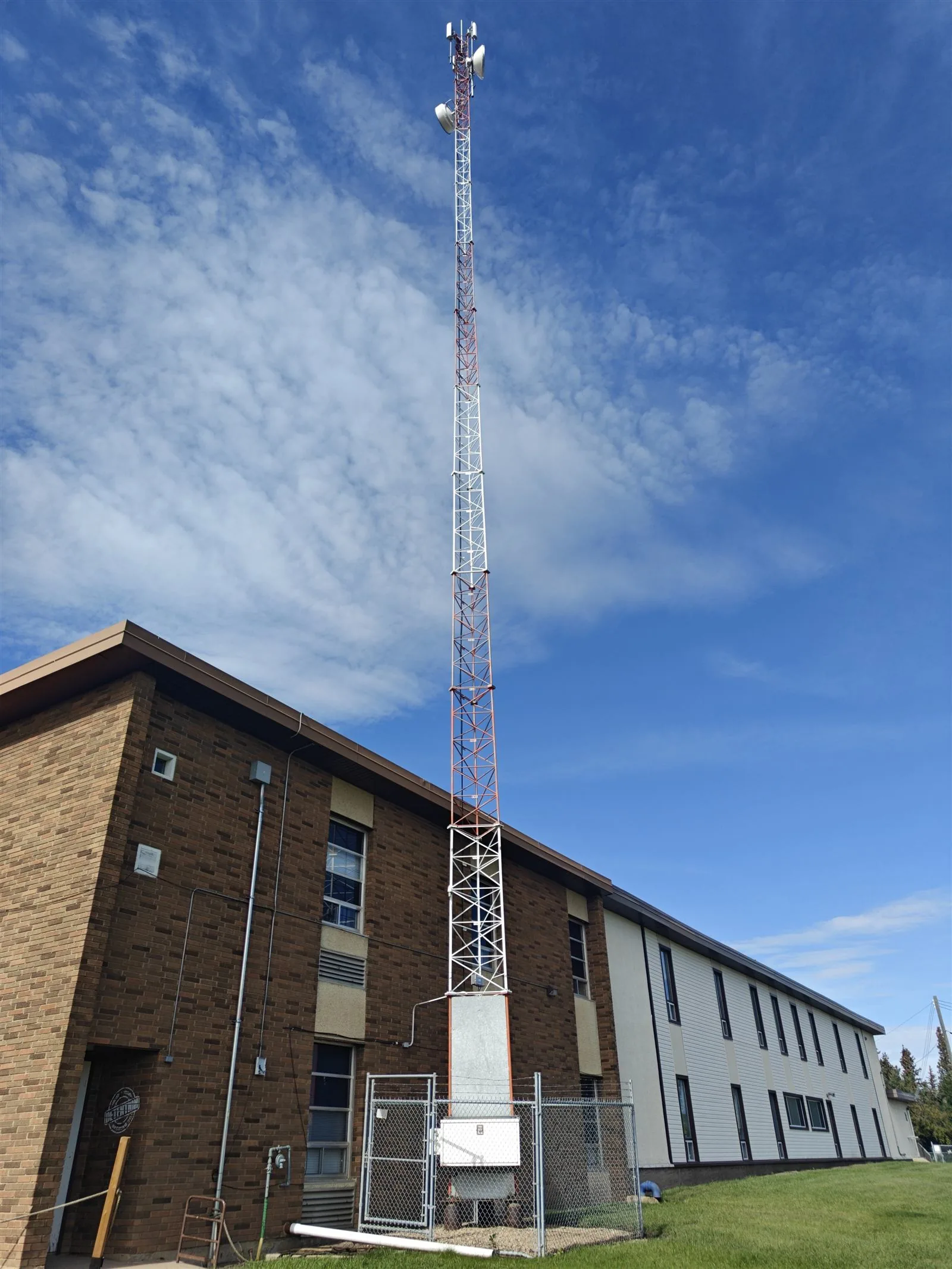 MCSnet tower near a school building in Rosalind, Alberta