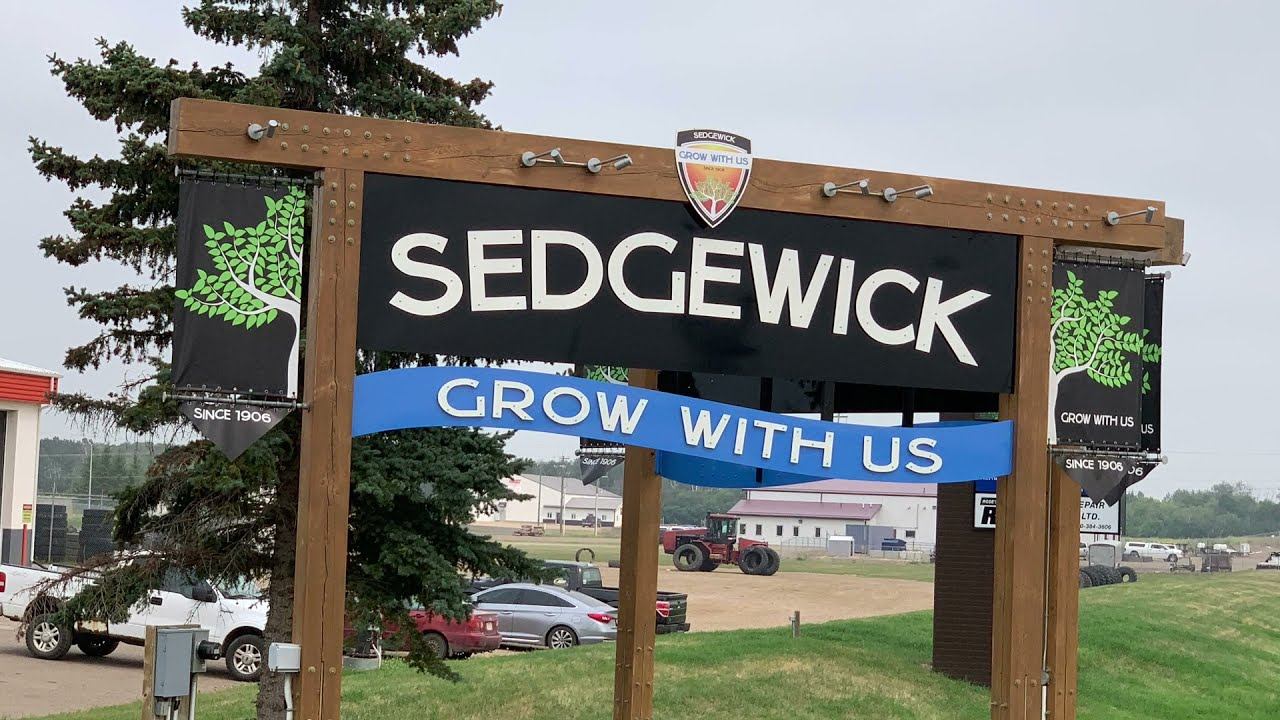 Sedgewick, Alberta town entrance sign reading Grow With Us