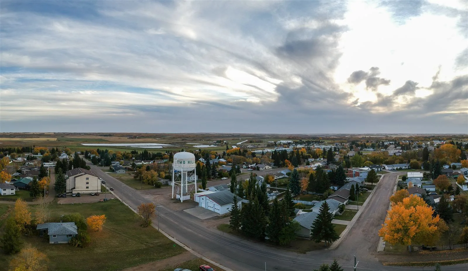Aerial view of the Two Hills water tower and townsite in autumn, Alberta
