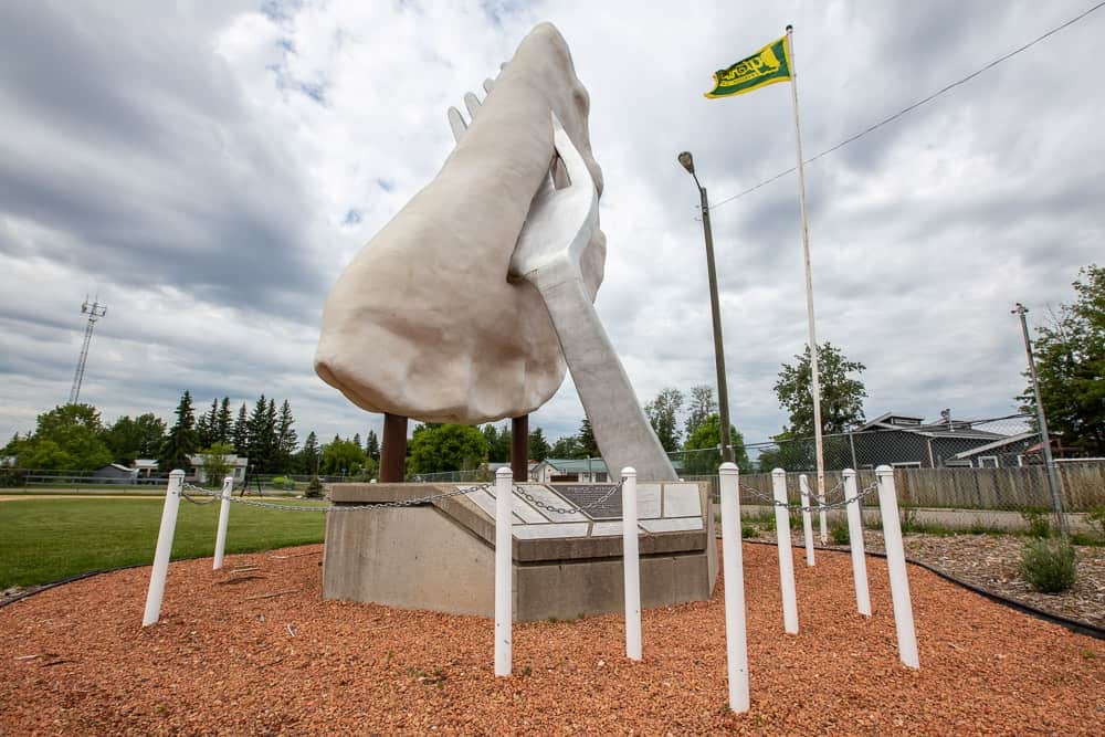 The giant perogy on a fork in Glendon, Alberta, a tall roadside sculpture on a concrete base with a green flag flying beside it