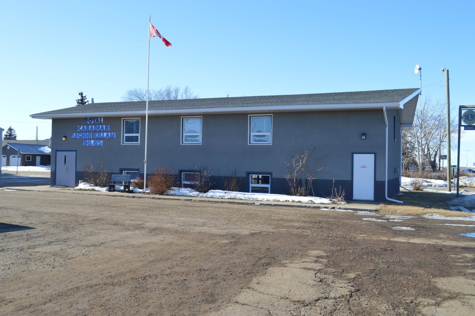 Royal Canadian Legion Killam Branch 65 building with the Canadian flag flying out front